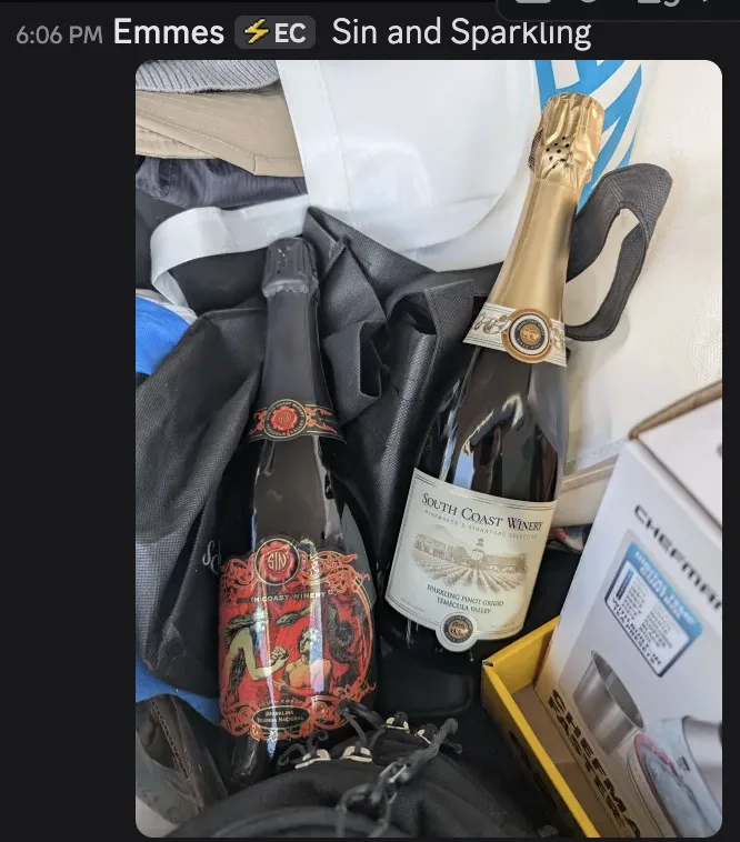 Discord message from Emmes at 6:06 PM reading "Sin and Sparkling", with a photo of two bottles of sparkling wine from South Coast Winery: one labelled Sin, one a Sparkling Pinot Grigio